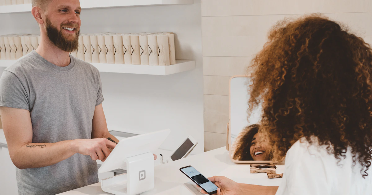 Business owner taking an enquiry call at a desk